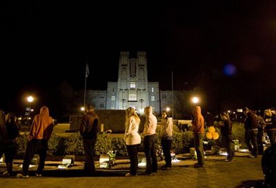 A crowd gathers just before midnight to watch the lighting of the memorial candle. 