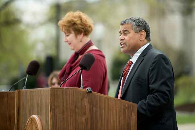 Patty Raun and Scott Johnson read the names of the 32.