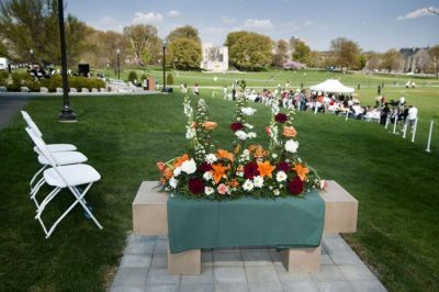 Bench with flowers prior to the start of the dedication ceremony