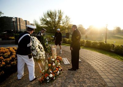 Provost Mark McNamee and President Charles W. Steger present two wreaths at the April 16 Memorial prior to the 3.2 Run in Remembrance.