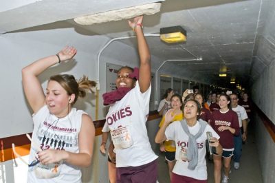 Runners pass through the tunnel in Lane Stadium.