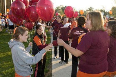 Runners pass out balloons prior to the start line of the 3.2 Run.